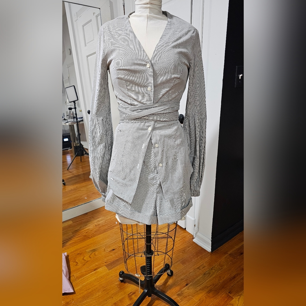 Balloon sleeve button-up wrap top with shorts.